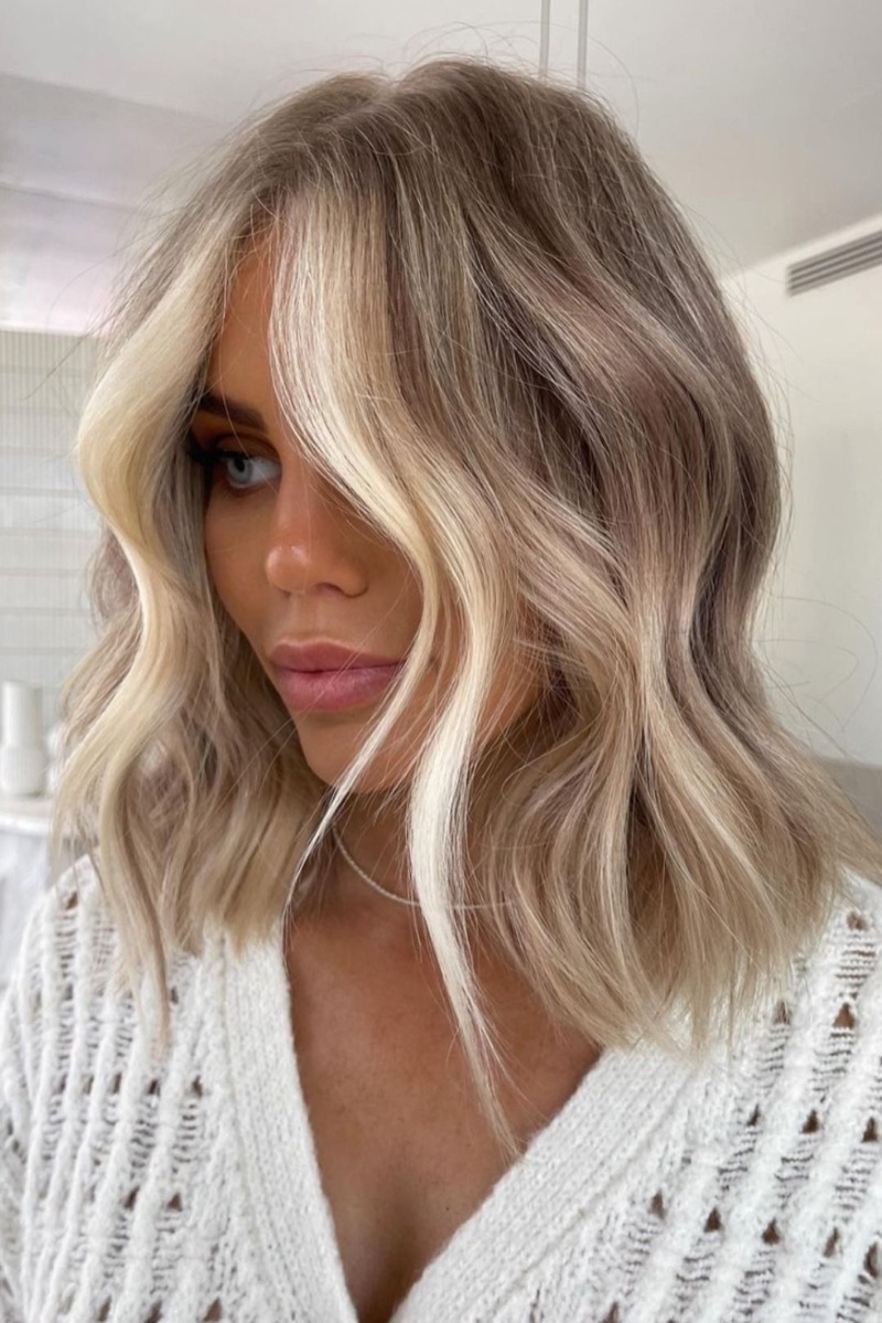 Soft blonde money piece blended into a balayage lob, Scott Farmer Hair Salon, Venice FL